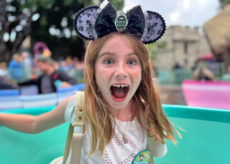 Taking Elementary-Aged Kids to Disneyland - Girl on Teacups