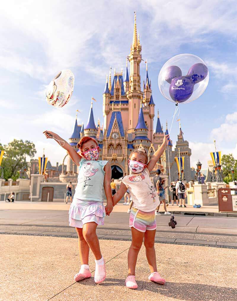 Disney World Reopening - Girls with Balloons in Front of Cinderella Castle