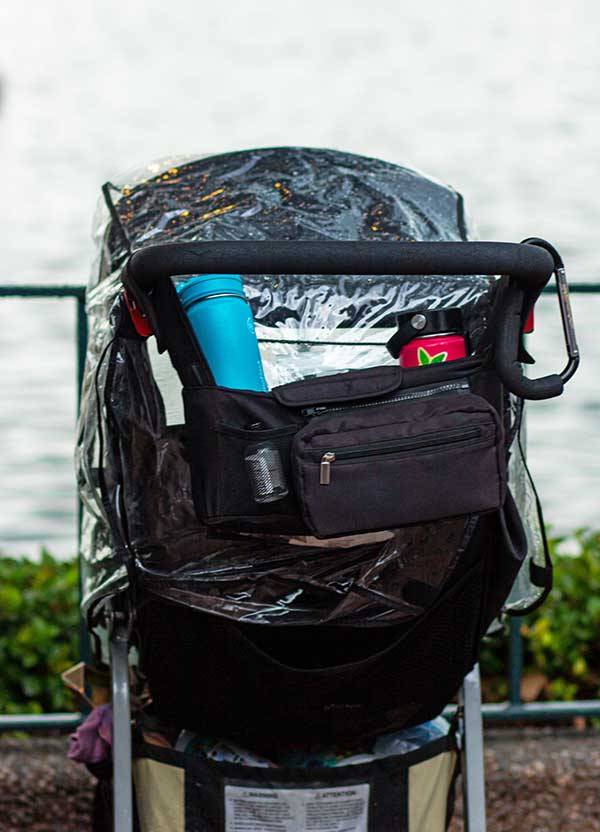 https://cache.undercovertourist.com/blog/2022/05/0722-rainy-day-disney-world-stroller-cover-vertical.jpg