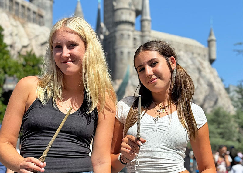 Choosing a Wand at the Wizarding World in Universal Studios Hollywood - guests with wands