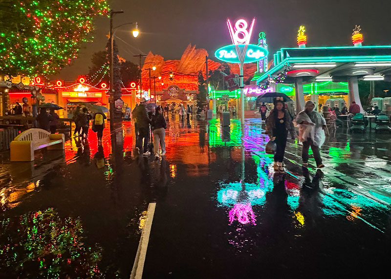 Essential Disneyland Rainy Day Tips - Cars Land rainy night reflections