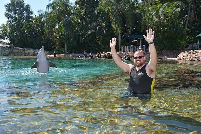 Discovery Cove Dolphin Swim - Ryan with dolphin