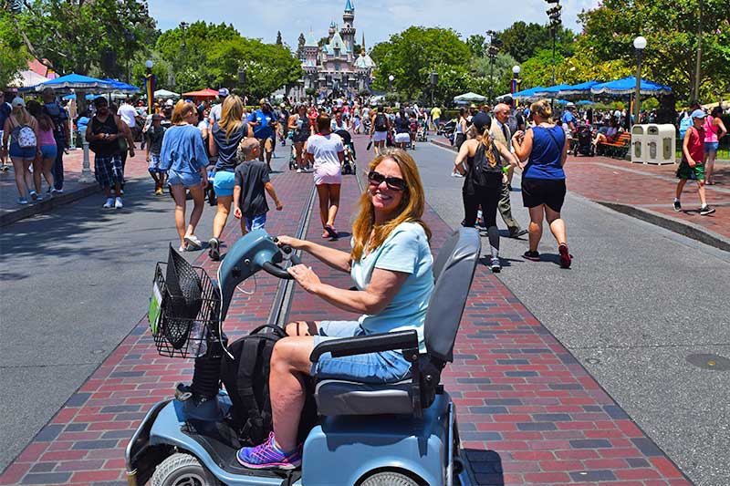 Using a Wheelchair at Disneyland - Woman in ECV