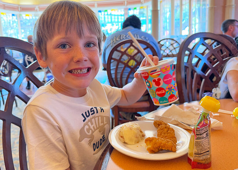 Top Disneyland Kids Meals - Boy with chicken tenders and mashed potatoes at Plaza Inn