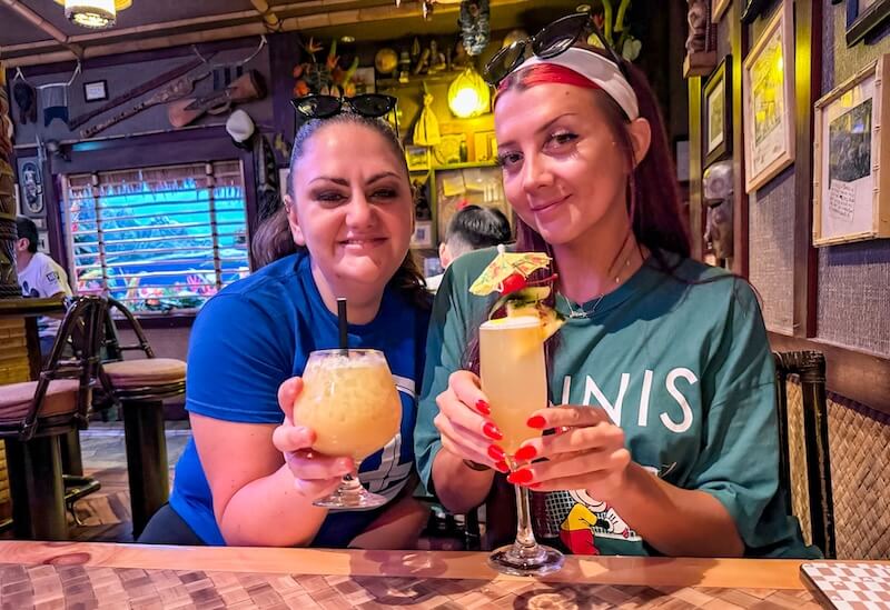 What Makes Disneyland Magical to Me - woman share drinks at Trader Sam's