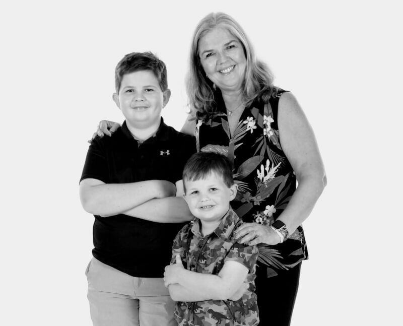Disney Cruise Photo Package - Grandma with two boys poses in casual black and white portrait
