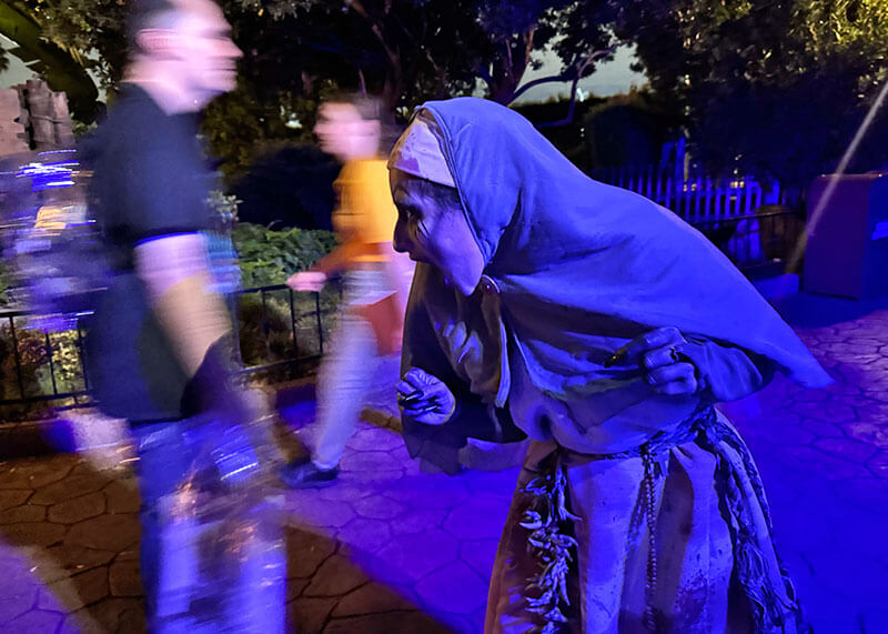 Your Ghoulish Guide to Knott’s Scary Farm - woman scareactor in The Gauntlet