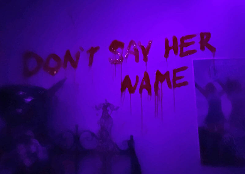 Your Ghoulish Guide to Knott’s Scary Farm - "Don't Say Her Name" in blood on the wall