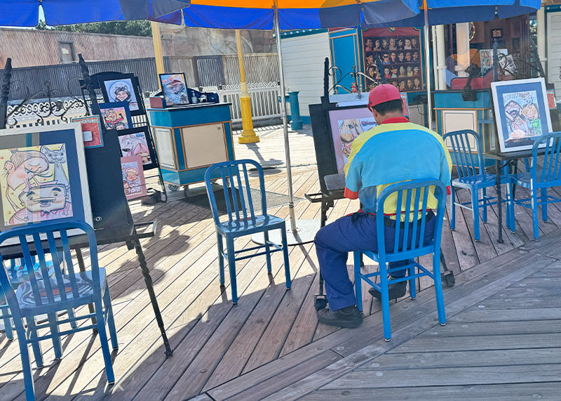 Bring Home the Magic With Unique & Personalized Souvenirs from Disneyland - Caricature stand on Pixar Pier