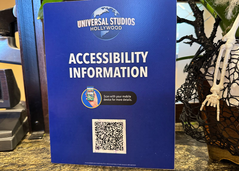 Overview of the Universal Studios Hollywood Attraction Assistance Pass (AAP) - QR code for accessibility information
