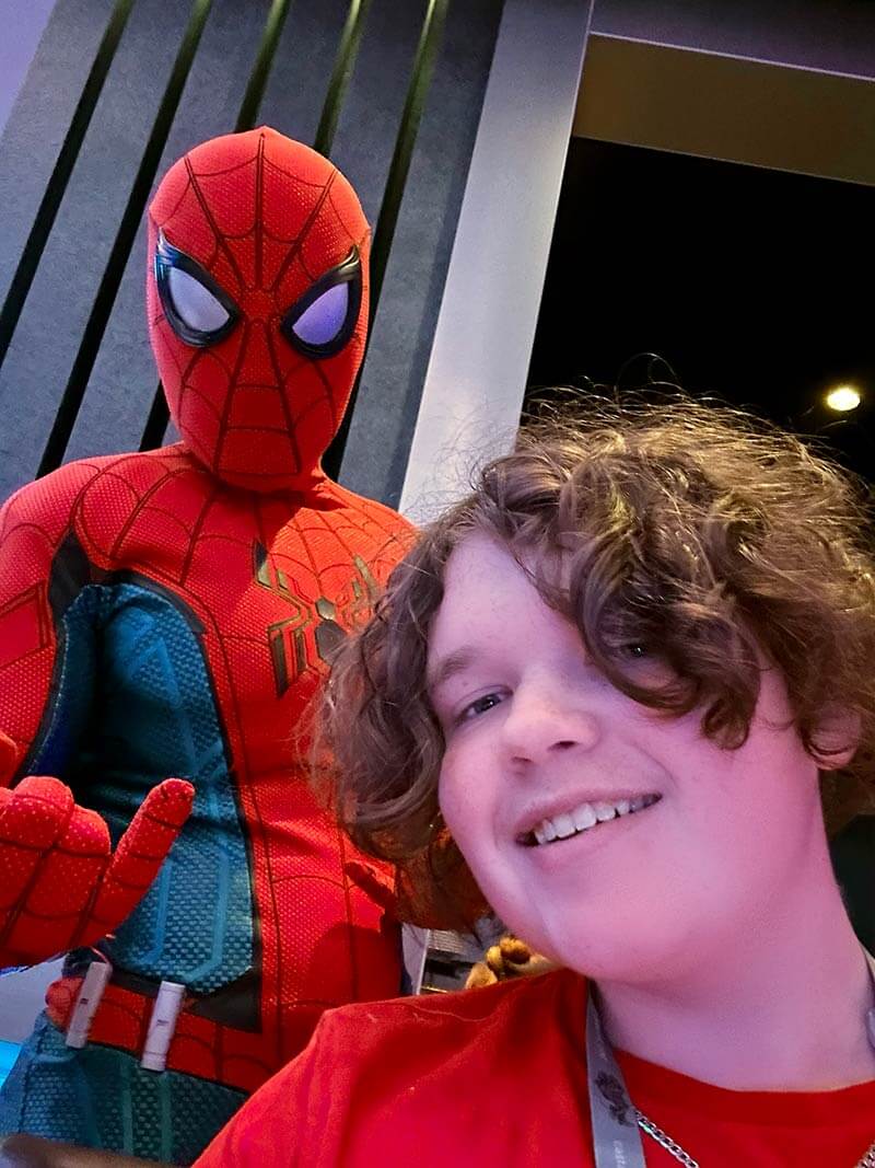 Best cruise for teens - teen snapping a selfie with Spider-Man