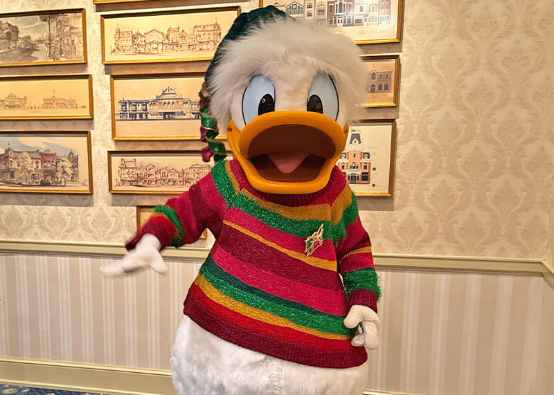 Guide to the ~Hoppiest~ Holidays at Disneyland 2025 - Donald in 70th holiday attire in Opera House