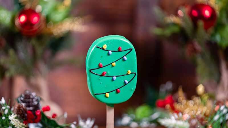 Our Guide to the Yummiest Holiday Treats & Foods at Disneyland Theme Parks - Tree Cake pop