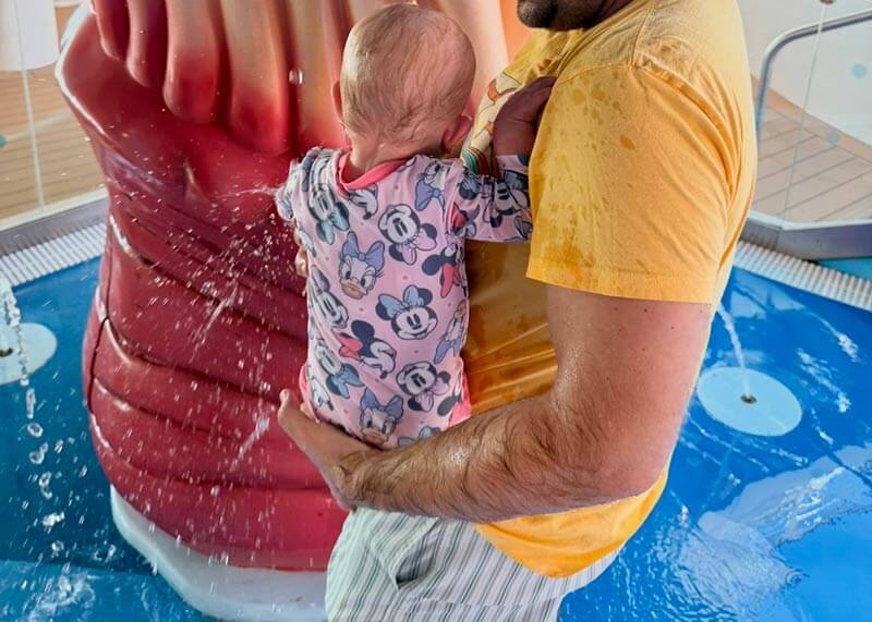 disney cruise with a baby - baby and dad in water play area