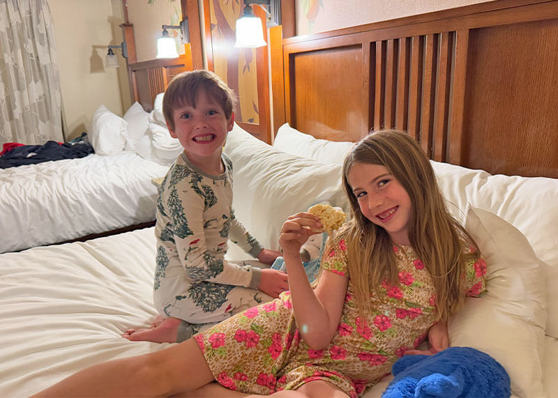 Taking Elementary-Aged Kids to Disneyland - Kids in bed at Disney's Grand Californian
