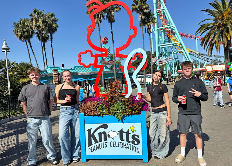 Everything to Know About PEANUTS Celebration at Knott's Berry Farm - Kids pose with decor
