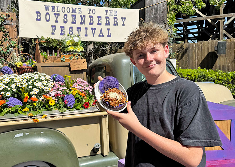 Your Guide to the Boysenberry Festival at Knott's Berry Farm - Teen with spaghetti in Boysenberry Bowl