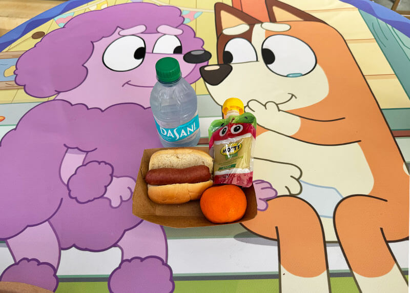 How to Have the Best Day Ever with Bluey at Disneyland - Kids hotdog meal with Bluey tablecloths