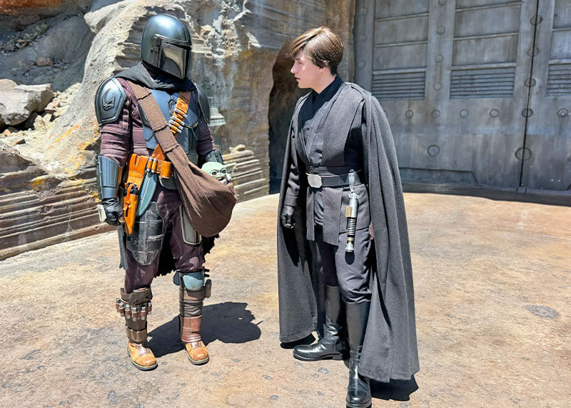 Our Galactic Guide to Star Wars: Galaxy’s Edge at Disneyland - Luke with Mandalorian