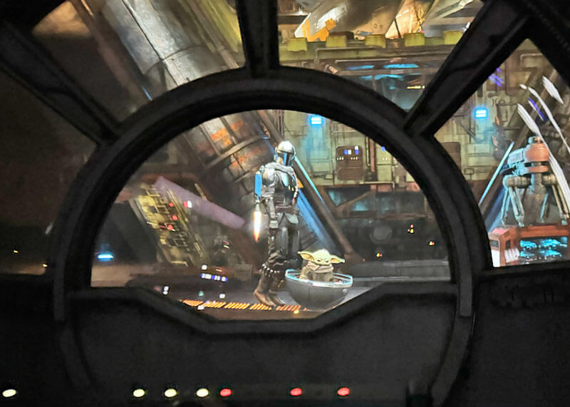 Mandalorian and Grogu at end scene of Millennium Falcon