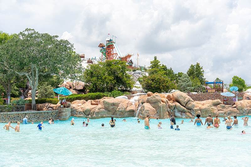 View of Summit Plummet waterslide from the Melt Away Bay beach area